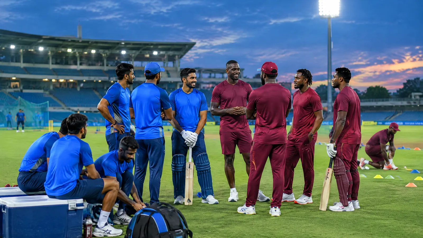 Cricket news image of unbranded Indian team training equipment and a white ball at a floodlit Thiruvananthapuram-style stadium