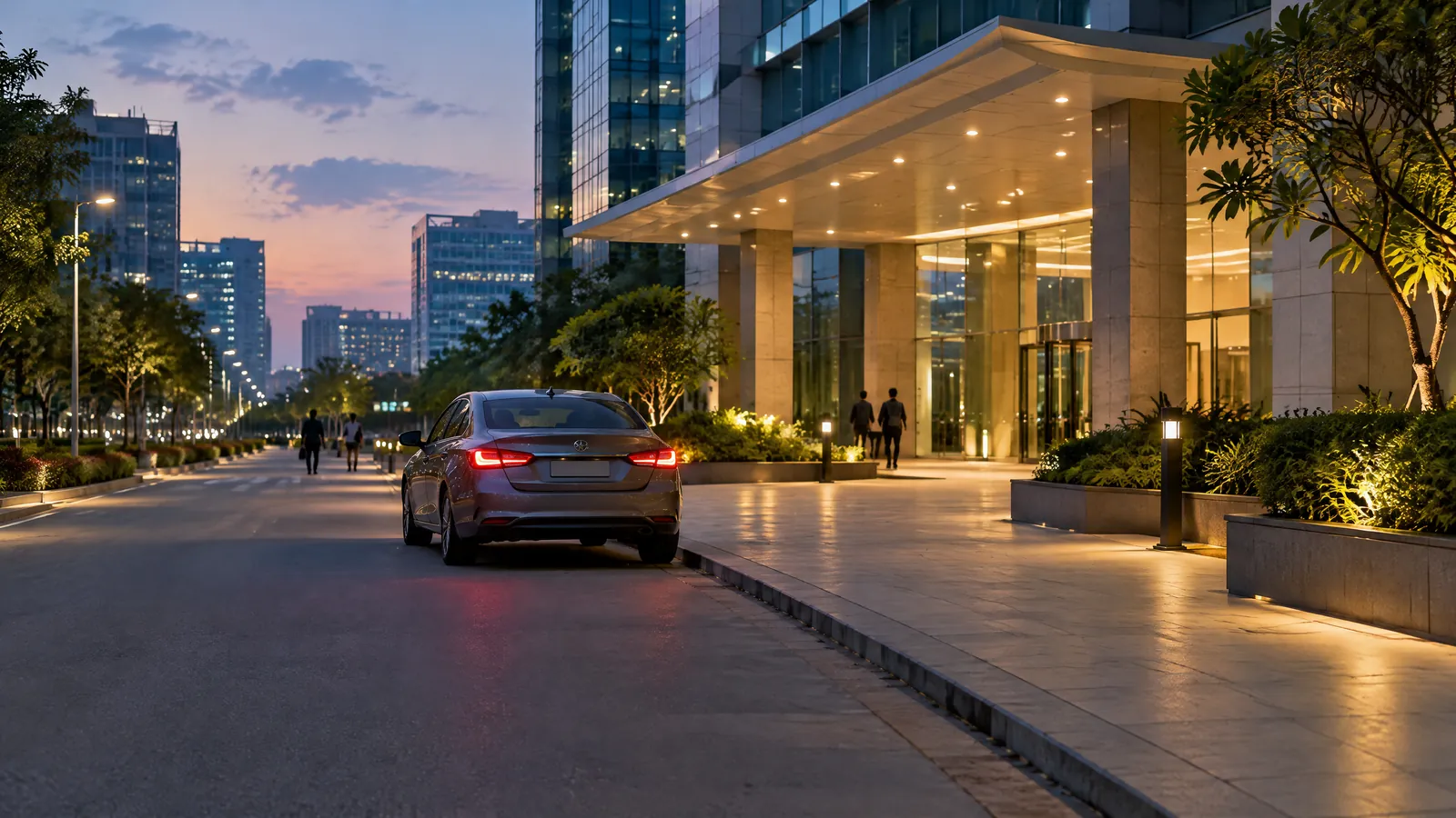 A discreet evening street scene in Hyderabad’s IT corridor with a cab waiting near a well-lit building entrance
