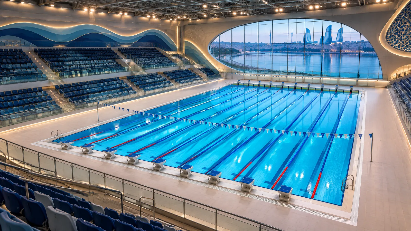 Wide view of an indoor 25-metre competition pool in Baku prepared for the 2026 Swimming World Cup, with empty lanes and spectator seating before racing